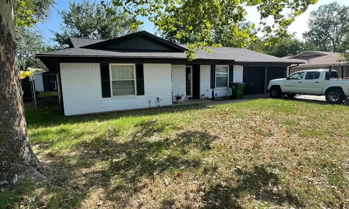 Professional roofing crew working on a residential roof in Santaquin